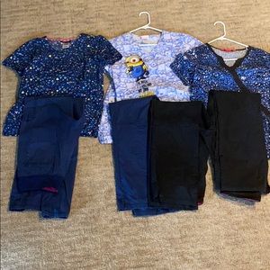 Lot of nurse scrubs. 3 tops and 4 pants.